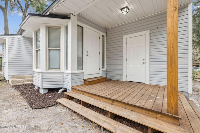 doorway to property with a deck