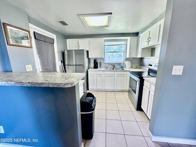 kitchen featuring white cabinetry, sink, stainless steel appliances, backsplash, and light tile patterned flooring