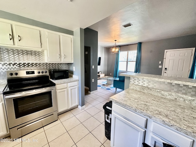 kitchen with backsplash, stainless steel range with electric stovetop, light tile patterned floors, an inviting chandelier, and hanging light fixtures