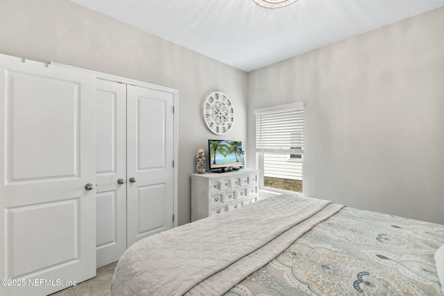 carpeted bedroom featuring a closet