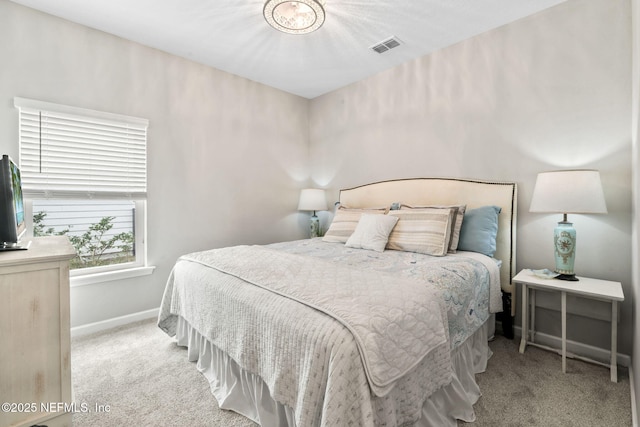 bedroom featuring light carpet