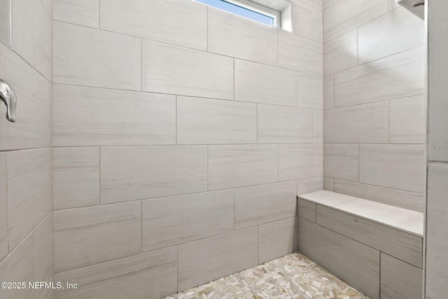 bathroom featuring tiled shower