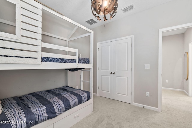 carpeted bedroom featuring a closet