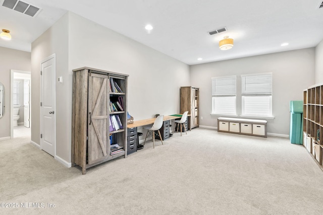 miscellaneous room with light colored carpet