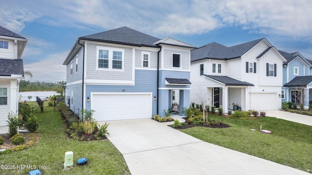 view of front of house featuring a garage and a front lawn