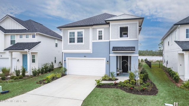 view of front facade featuring a garage and a front lawn