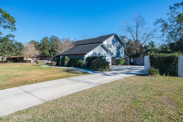 view of home's exterior with a yard