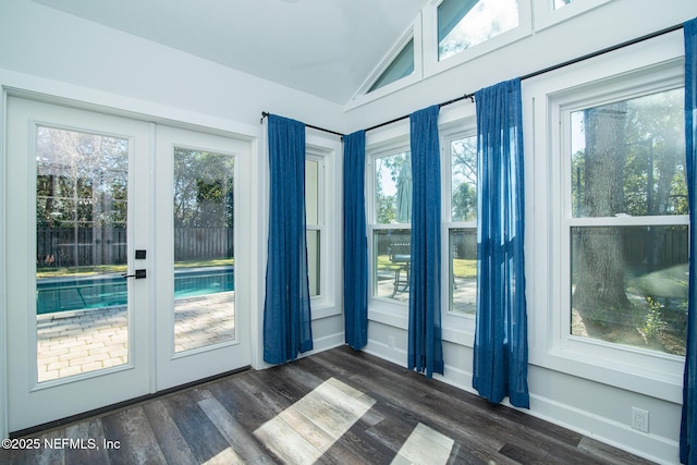 entryway featuring french doors, dark hardwood / wood-style flooring, and vaulted ceiling