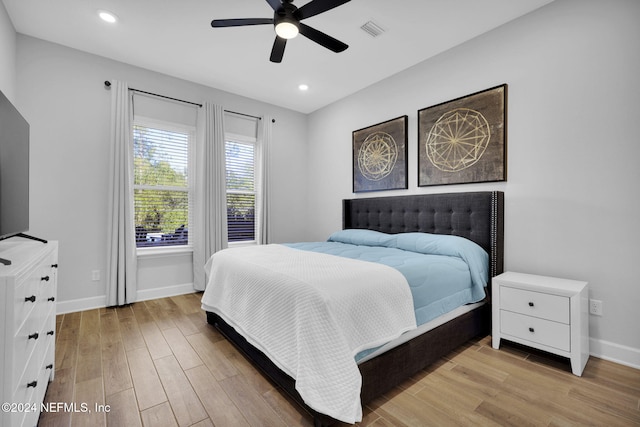 bedroom featuring light wood-type flooring and ceiling fan