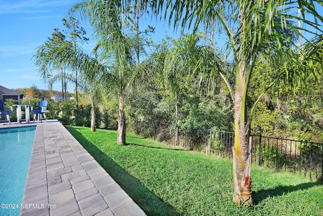 view of yard featuring a fenced in pool