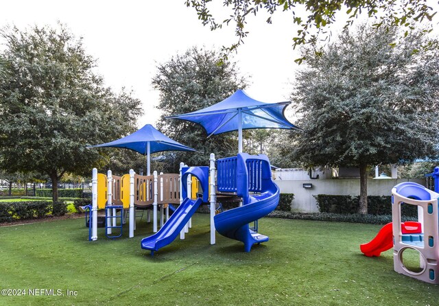 view of jungle gym with a yard