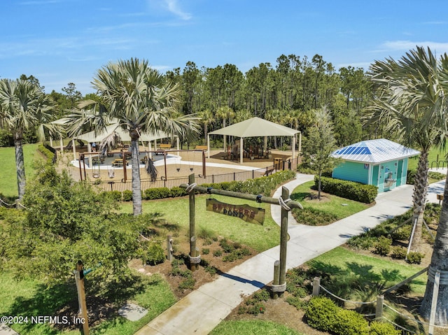 view of property's community with a gazebo and a yard