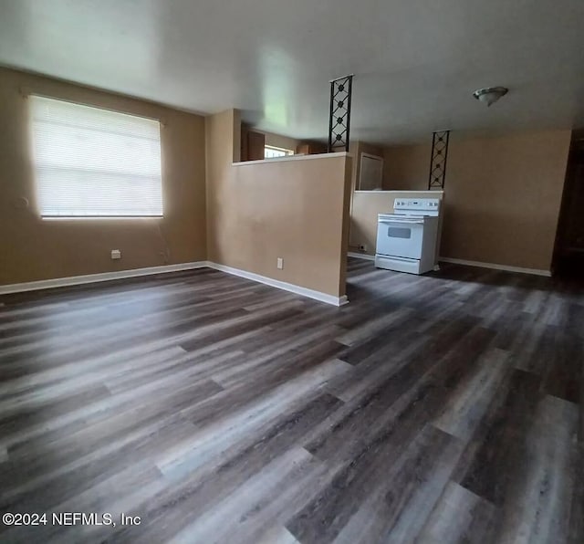 unfurnished living room featuring dark hardwood / wood-style flooring