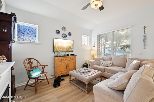 living room featuring light wood-type flooring, ceiling fan, and lofted ceiling