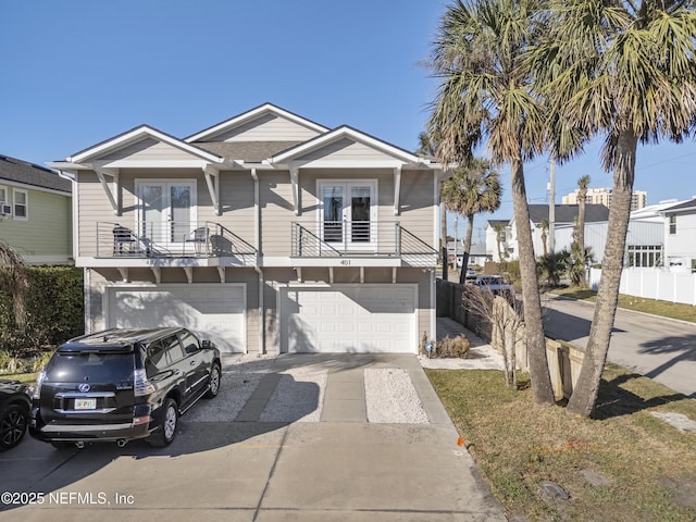 view of front of house with a balcony and a garage