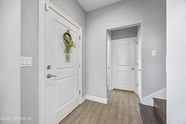 foyer with light hardwood / wood-style floors