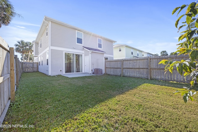 back of house featuring a lawn, cooling unit, and a patio area