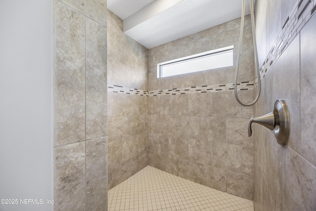 bathroom featuring tiled shower