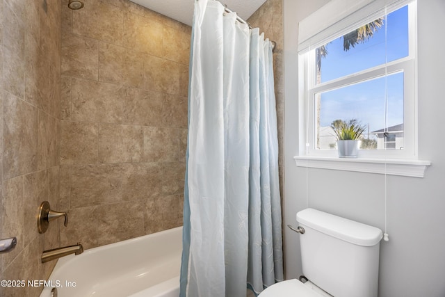 bathroom featuring toilet and shower / bath combo with shower curtain