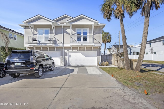 view of front facade with a garage and a balcony