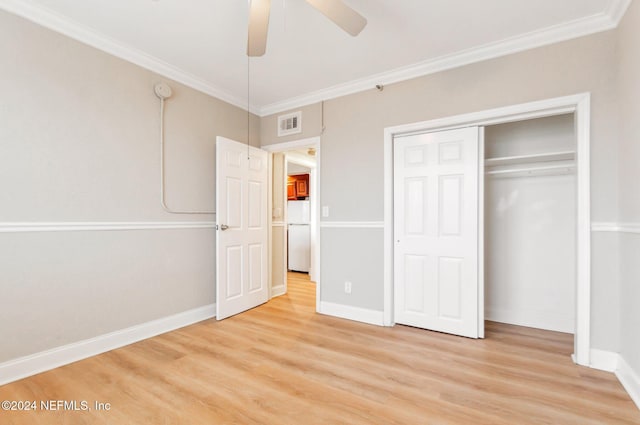 unfurnished bedroom with ceiling fan, a closet, ornamental molding, and white fridge