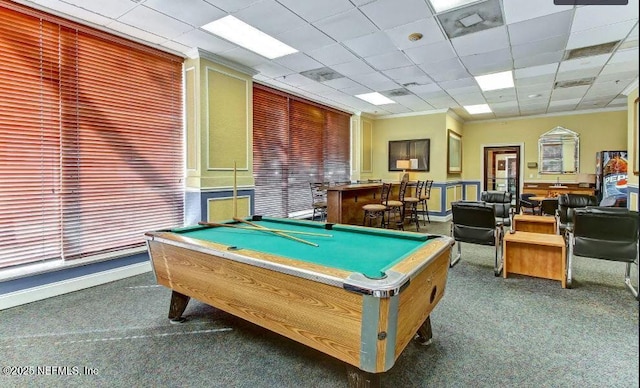 recreation room featuring a drop ceiling, billiards, and dark colored carpet