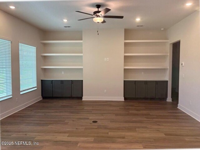 36199 Pitch Ln, Hilliard, FL 32046 - unfurnished living room with a ceiling fan, built in features, dark wood-style floors, baseboards, and recessed lighting