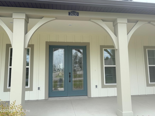 36199 Pitch Ln, Hilliard, FL 32046 - doorway to property with french doors and board and batten siding