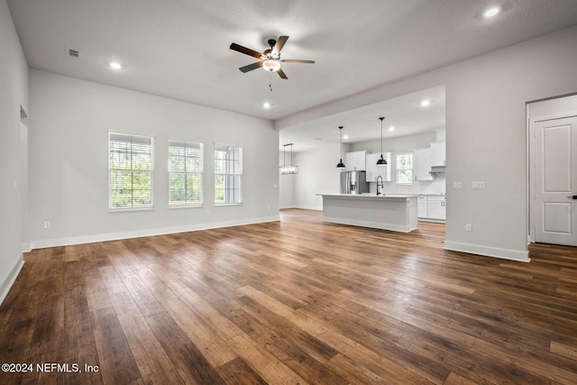 36231 Pitch Ln, Hilliard, FL 32046 - unfurnished living room featuring a ceiling fan, dark wood-style floors, and recessed lighting