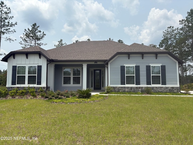 36231 Pitch Ln, Hilliard, FL 32046 - view of front of property with a front yard, roof with shingles, and board and batten siding