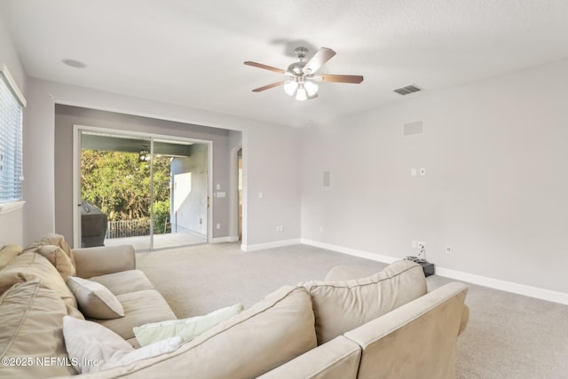 living room with light colored carpet and ceiling fan