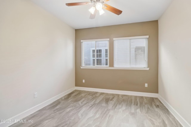 unfurnished room featuring ceiling fan and light hardwood / wood-style flooring