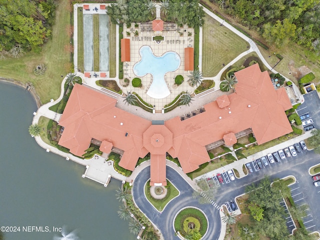 birds eye view of property with a water view