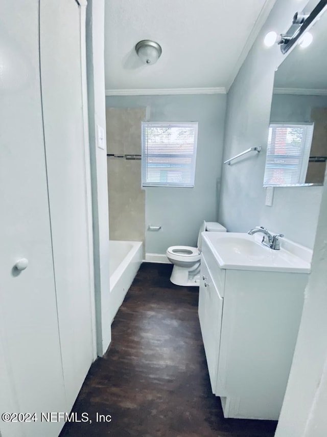 bathroom with vanity, hardwood / wood-style flooring, toilet, and crown molding