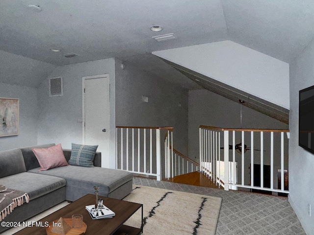 living room featuring vaulted ceiling