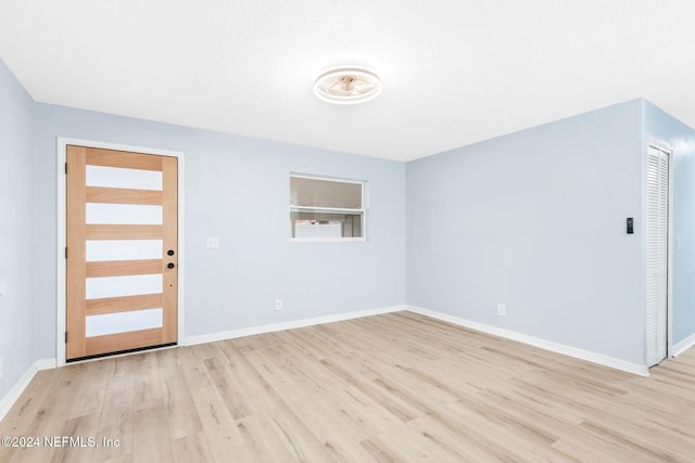 entryway with light hardwood / wood-style floors