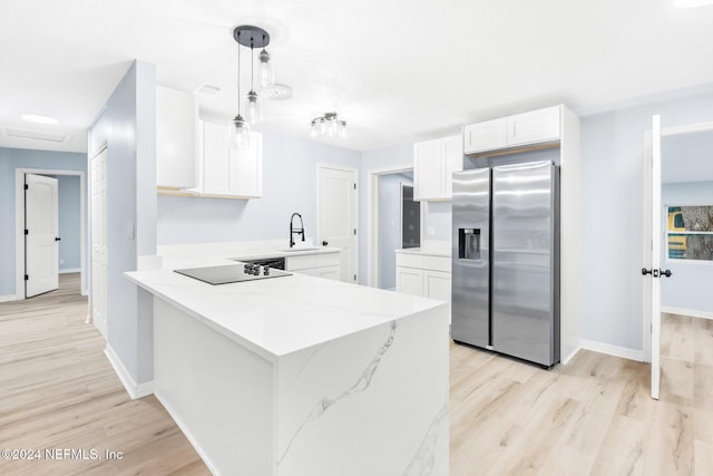 kitchen with kitchen peninsula, black electric stovetop, pendant lighting, stainless steel fridge with ice dispenser, and white cabinetry