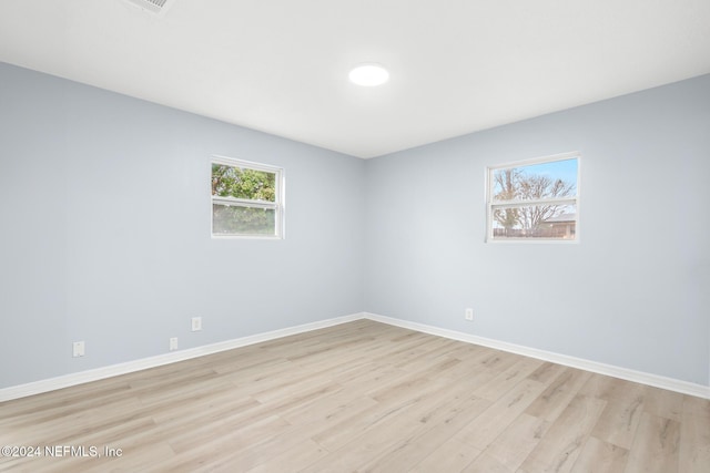 spare room featuring light hardwood / wood-style floors