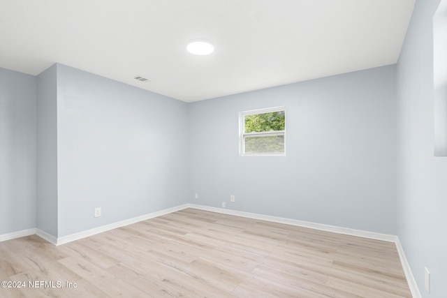 spare room featuring light wood-type flooring