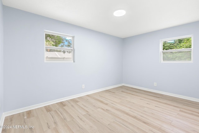 spare room with light hardwood / wood-style flooring