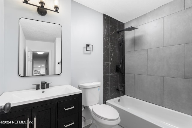 full bathroom featuring vanity, toilet, and tiled shower / bath combo