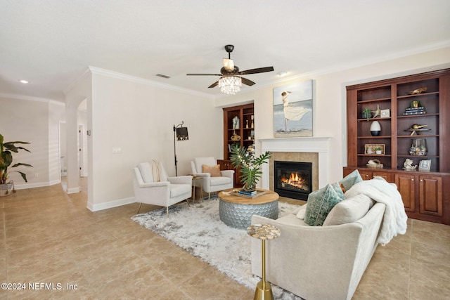 living room featuring ceiling fan and ornamental molding