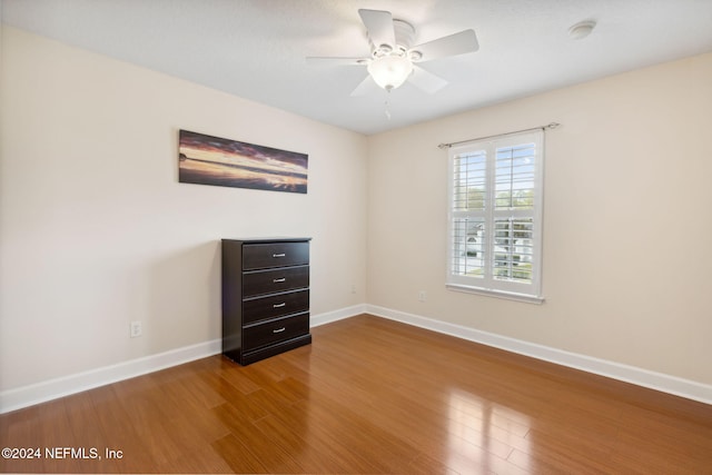 unfurnished bedroom featuring ceiling fan and hardwood / wood-style flooring