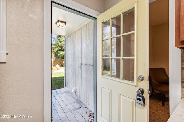 doorway to outside with hardwood / wood-style floors