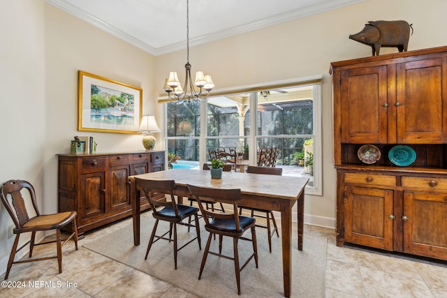 dining area featuring light tile patterned floors, an inviting chandelier, and ornamental molding