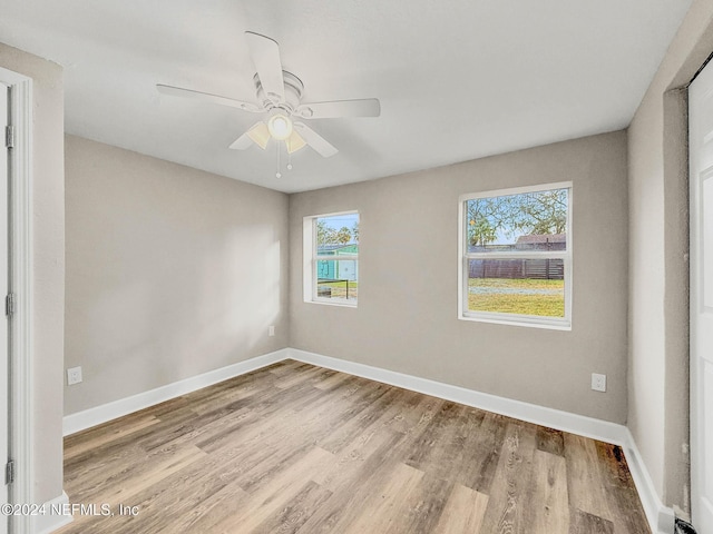 unfurnished room featuring ceiling fan and light hardwood / wood-style flooring