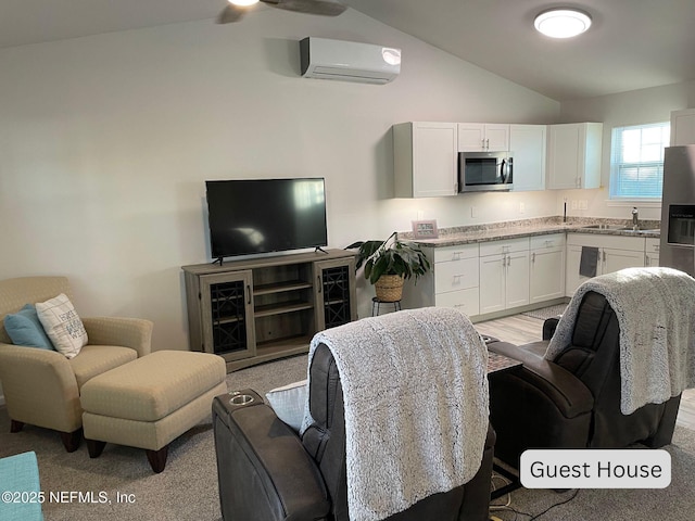 living room featuring vaulted ceiling, ceiling fan, and a wall mounted air conditioner