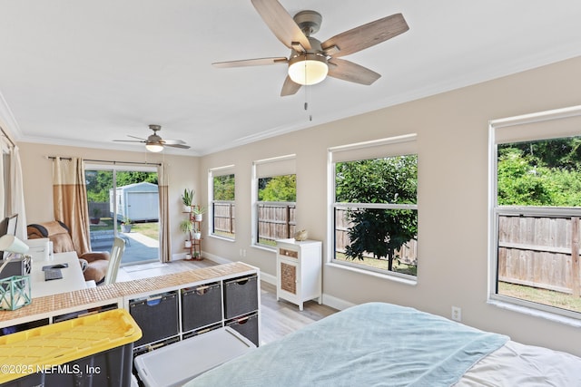 bedroom with access to outside, light hardwood / wood-style flooring, ceiling fan, and ornamental molding