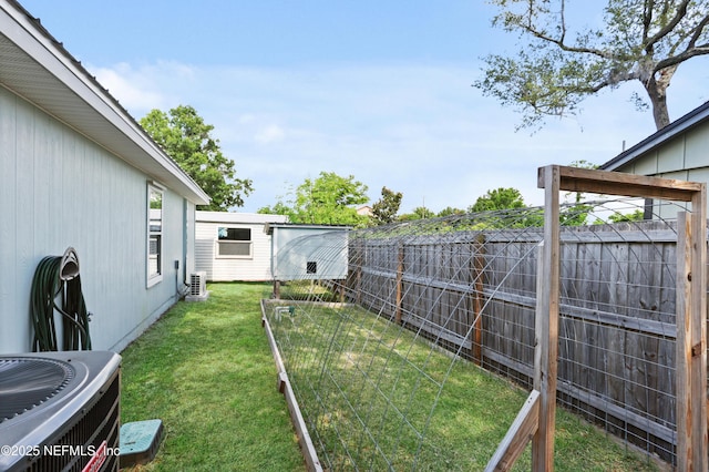 view of yard featuring central AC unit