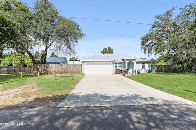 ranch-style home featuring a front yard and a garage